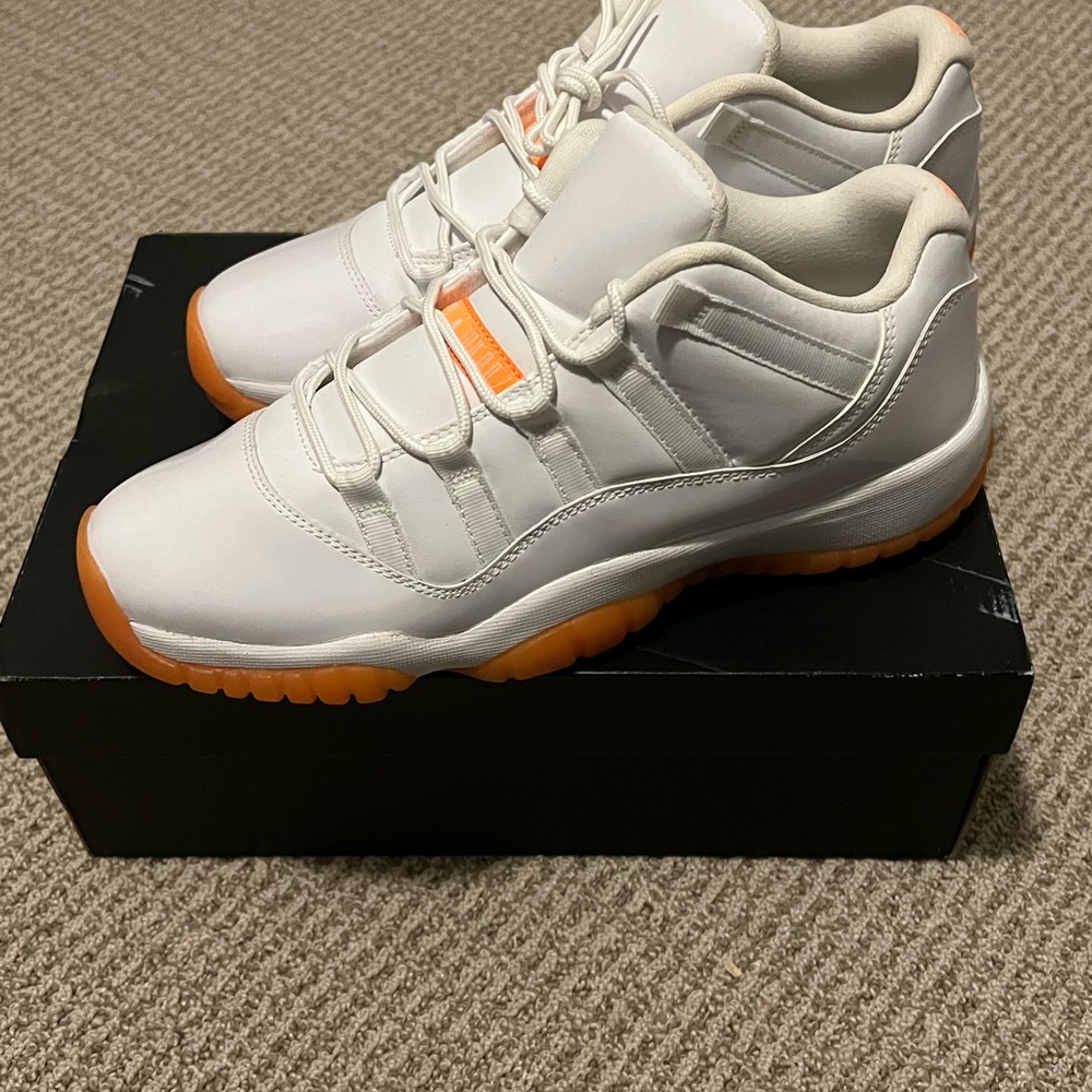 Nike Air Jordan 11 Retro Low GG in white and orange size 9Y